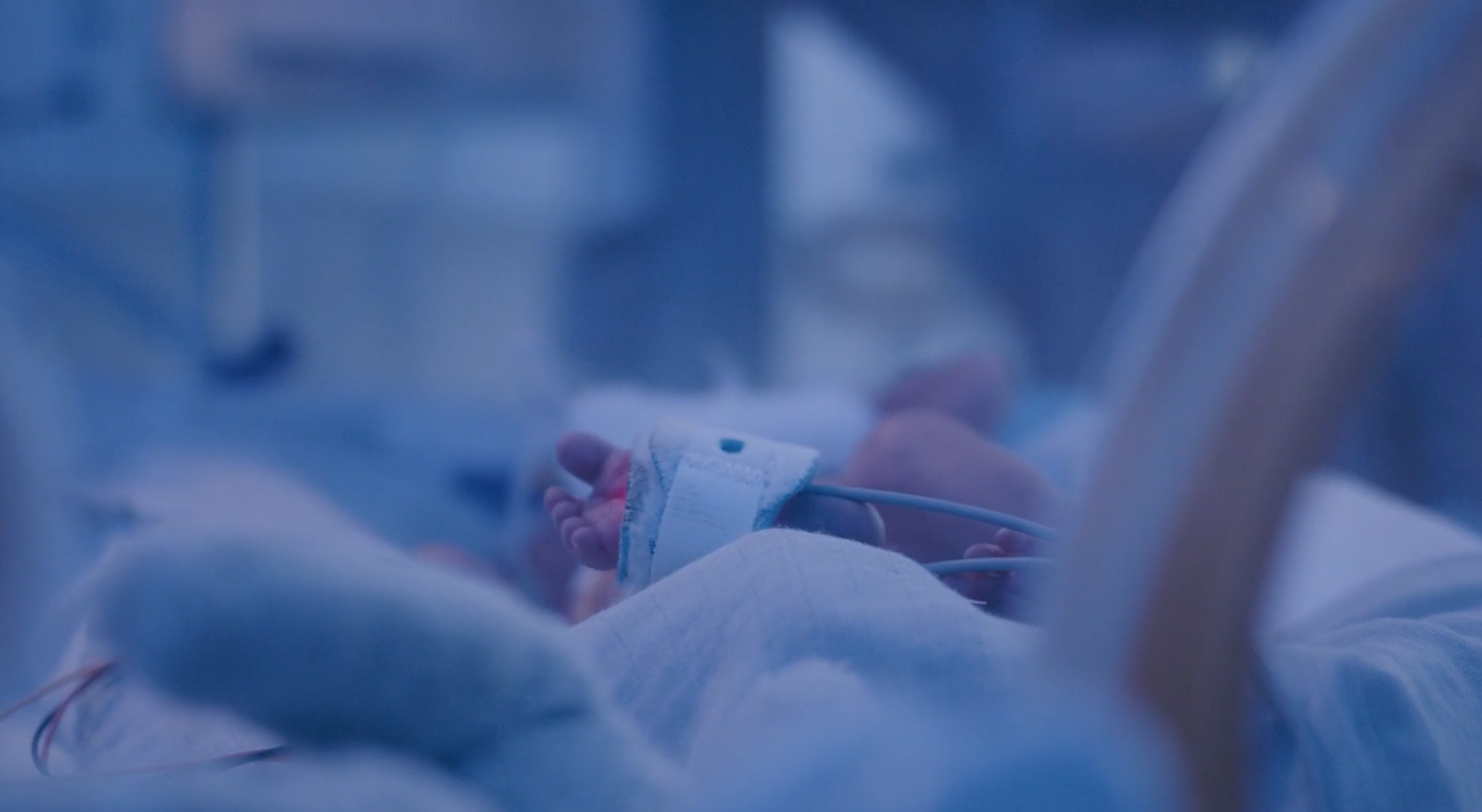 A photograph of a new born baby in the hospital